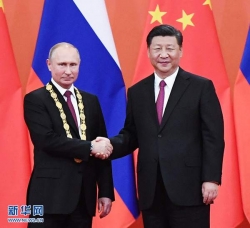 中俄元首决定将两国关系提升为“新时代中俄全面战略协作伙伴关系”  